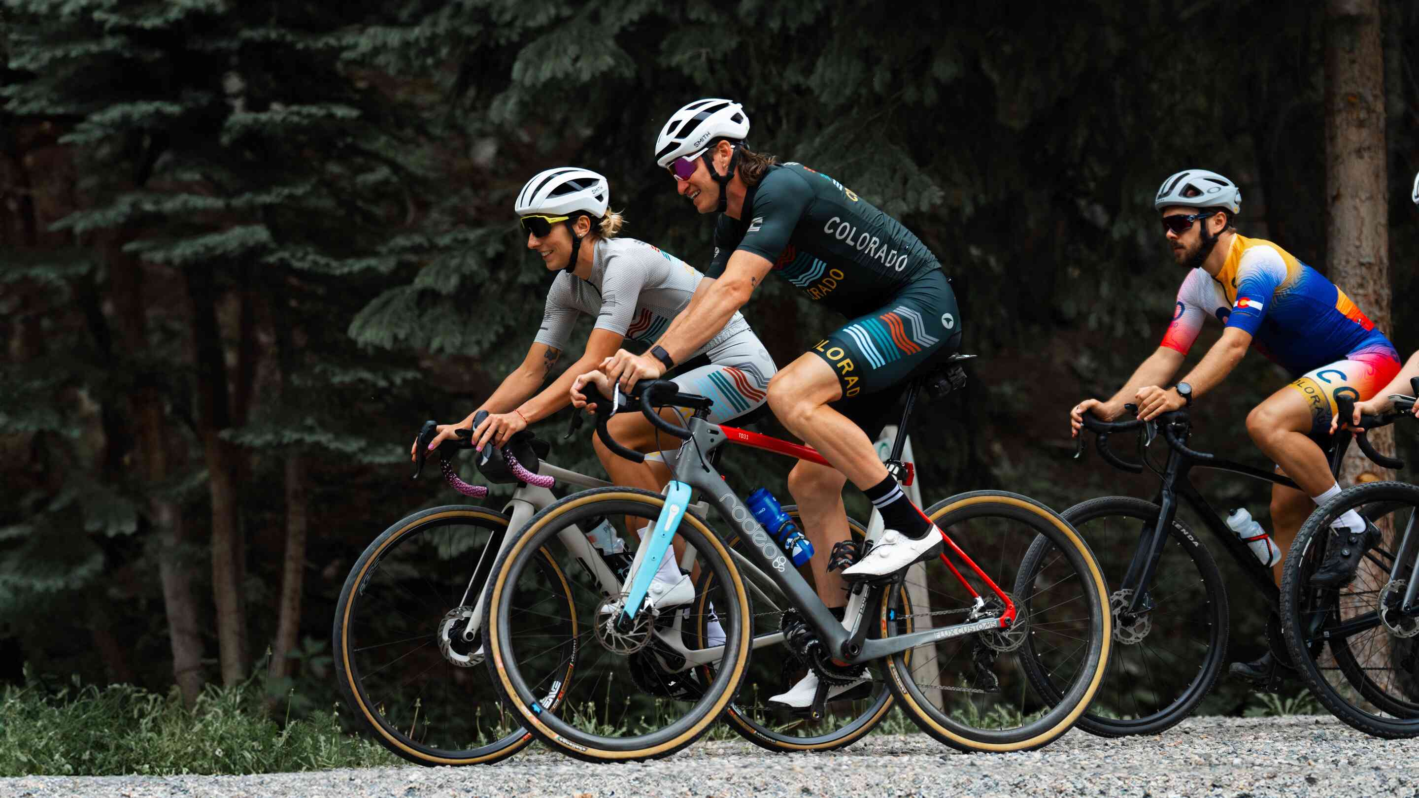 Group of Cyclists in Colorado Themed Cycling Kits